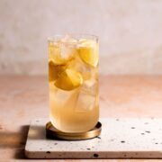 A 7 and 7 cocktail sitting on a marble board.