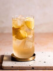 A 7 and 7 cocktail sitting on a marble board.