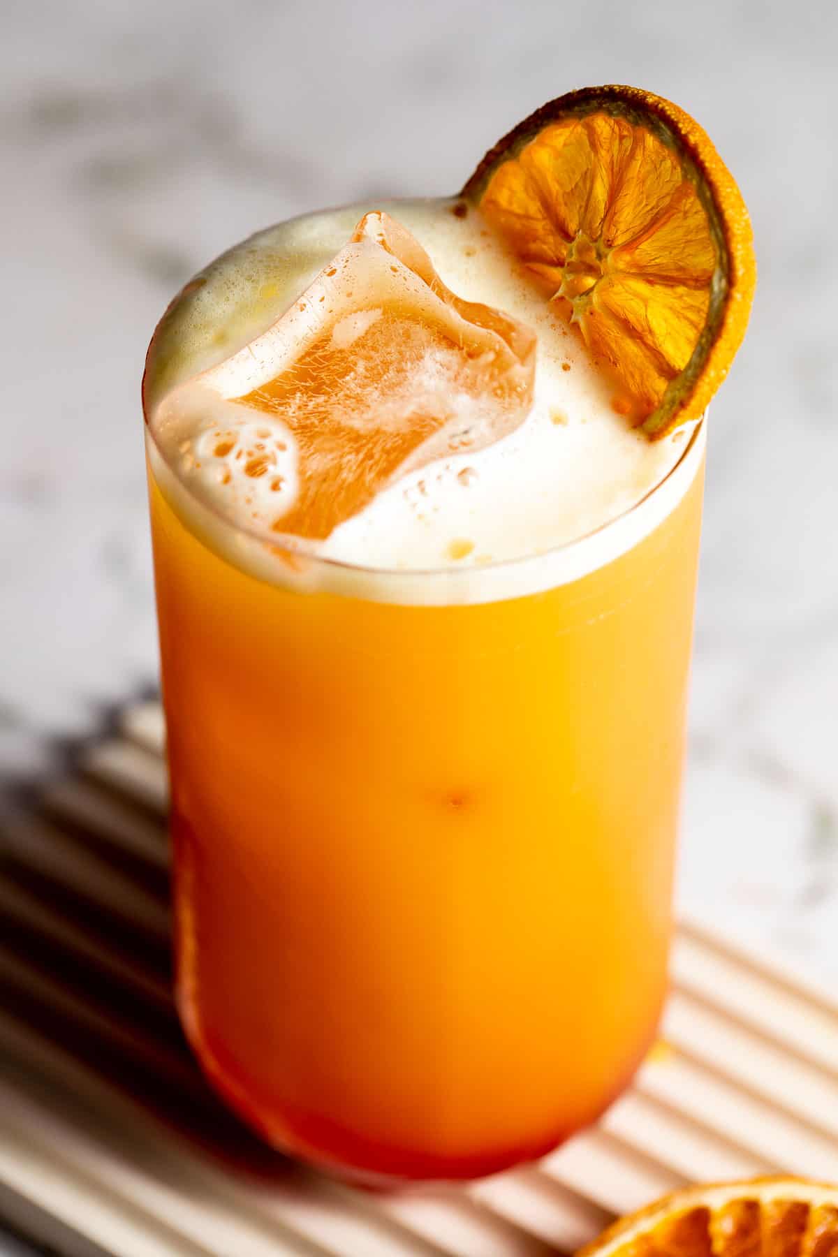 A Garibaldi cocktail garnished with an orange slice.