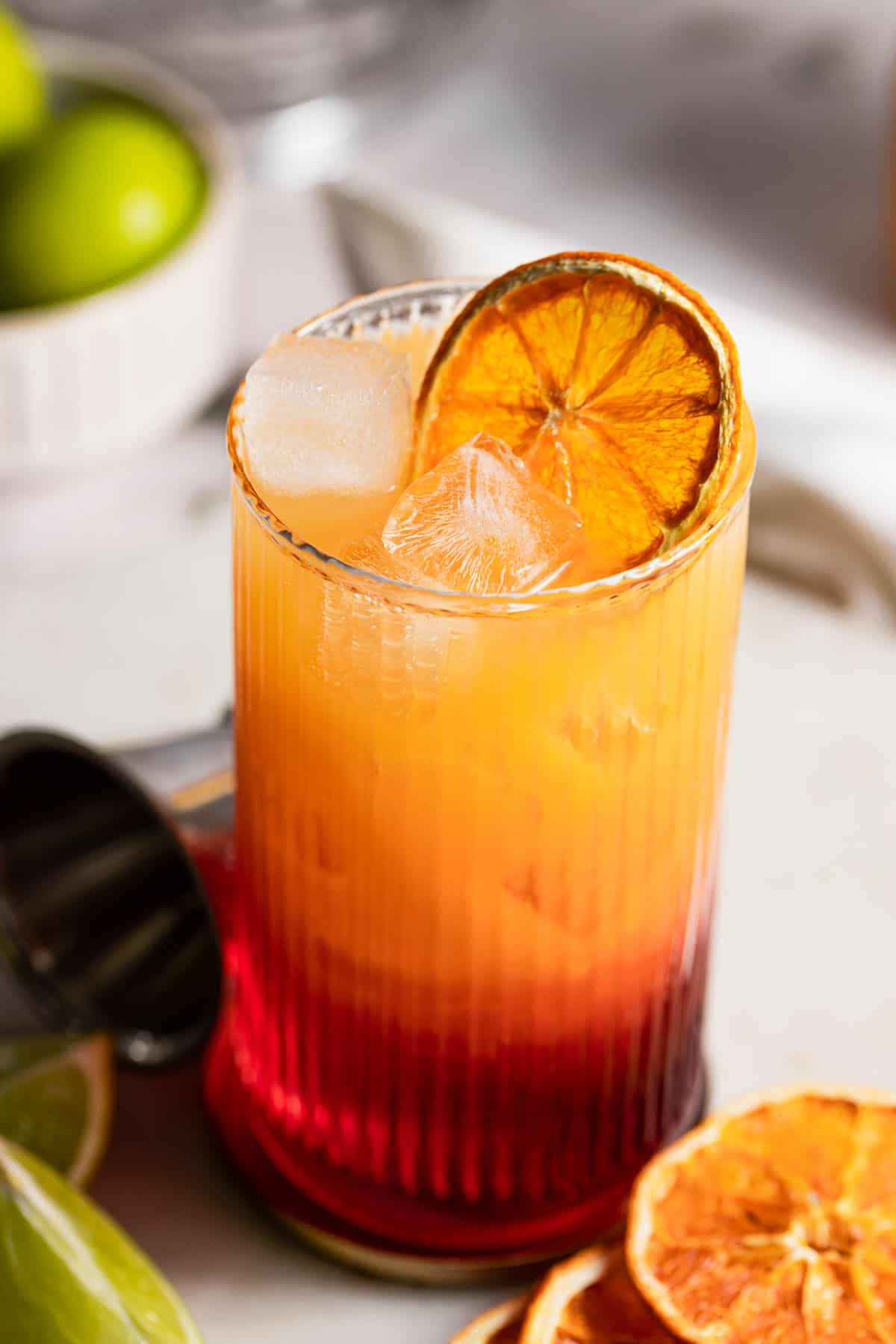 A madras cocktail garnished with a dried citrus wheel.