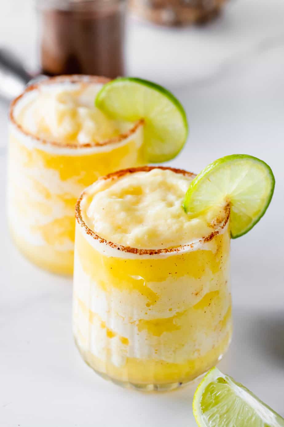 Pineapple margaritas with a spicy chili salt rim.