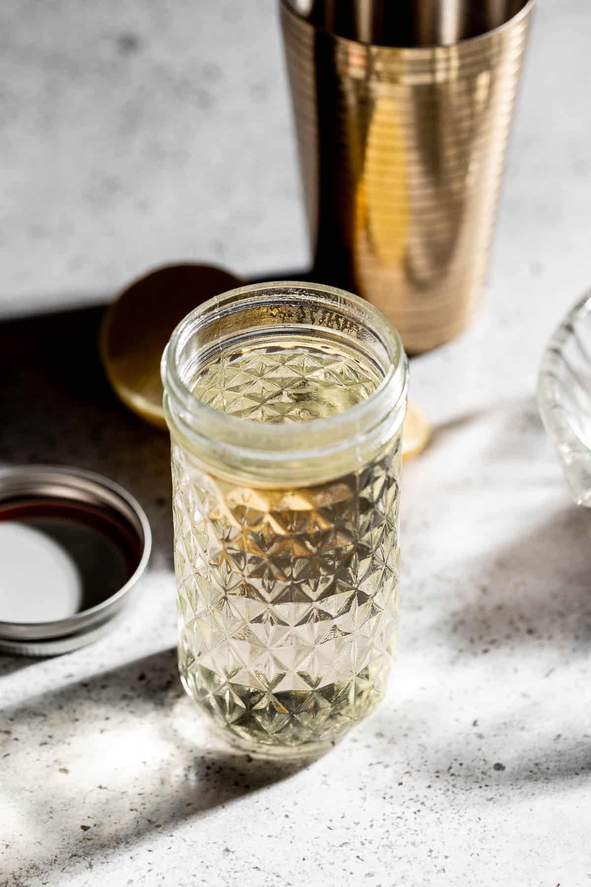 A mason jar filled with homemade simple syrup. 