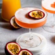 pornstar martini in coupe glass topped with halved passionfruit