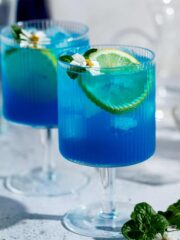 Two blue motorcycle drinks sitting on a counter.